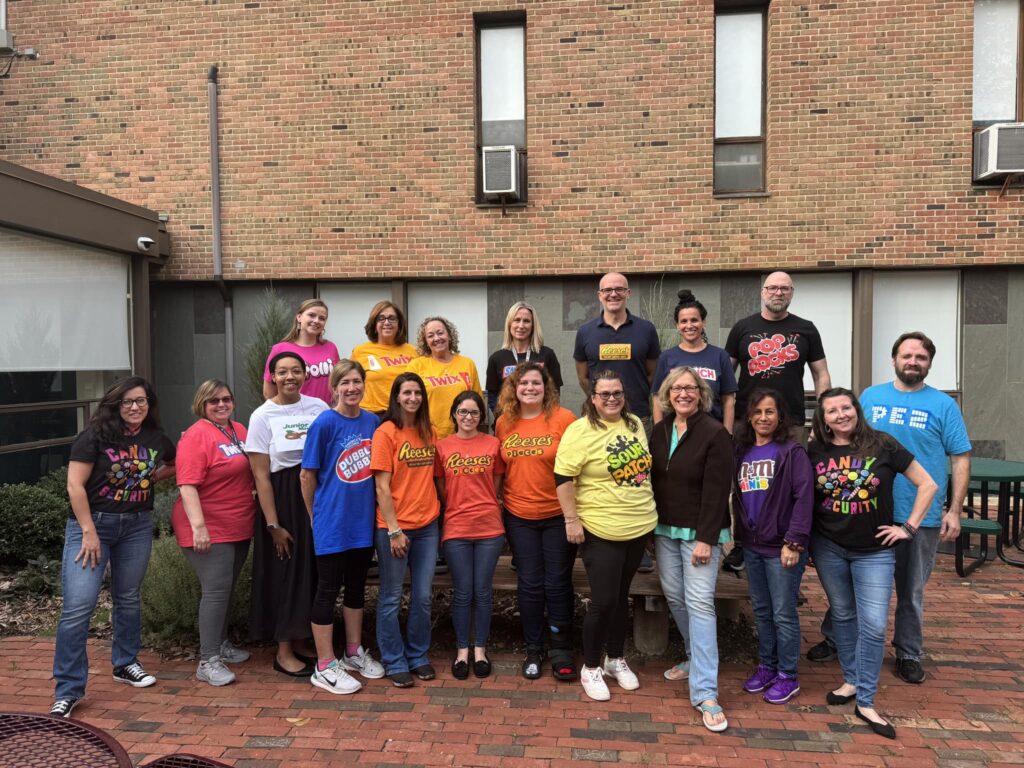 Ben Bronz Academy staff and mediators dress in their favorite candy t-shirts for Halloween.