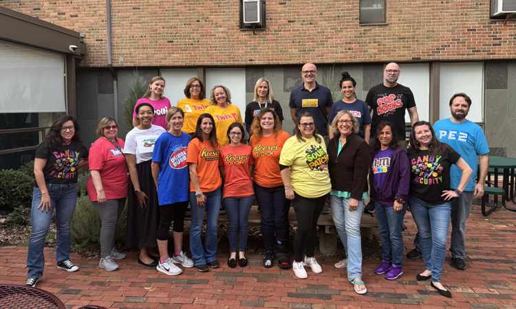 Ben Bronz Academy staff and mediators dress in their favorite candy t-shirts for Halloween.