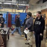 Group of students visit vocational school.