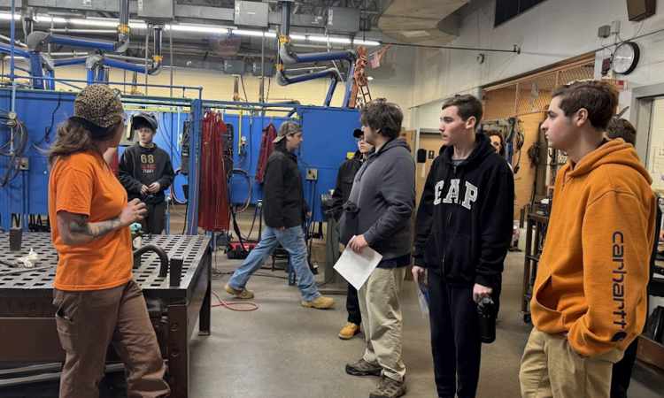 Group of students visit vocational school.